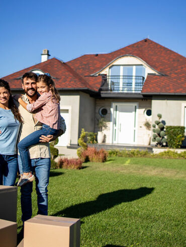 Happy family just bought a new house and moving in.